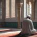 Muslim man praying in mosque